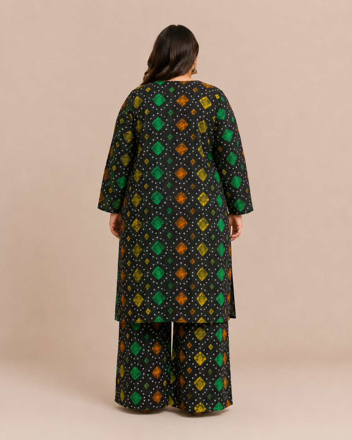Back view of a plus-size model posing in a matching black,