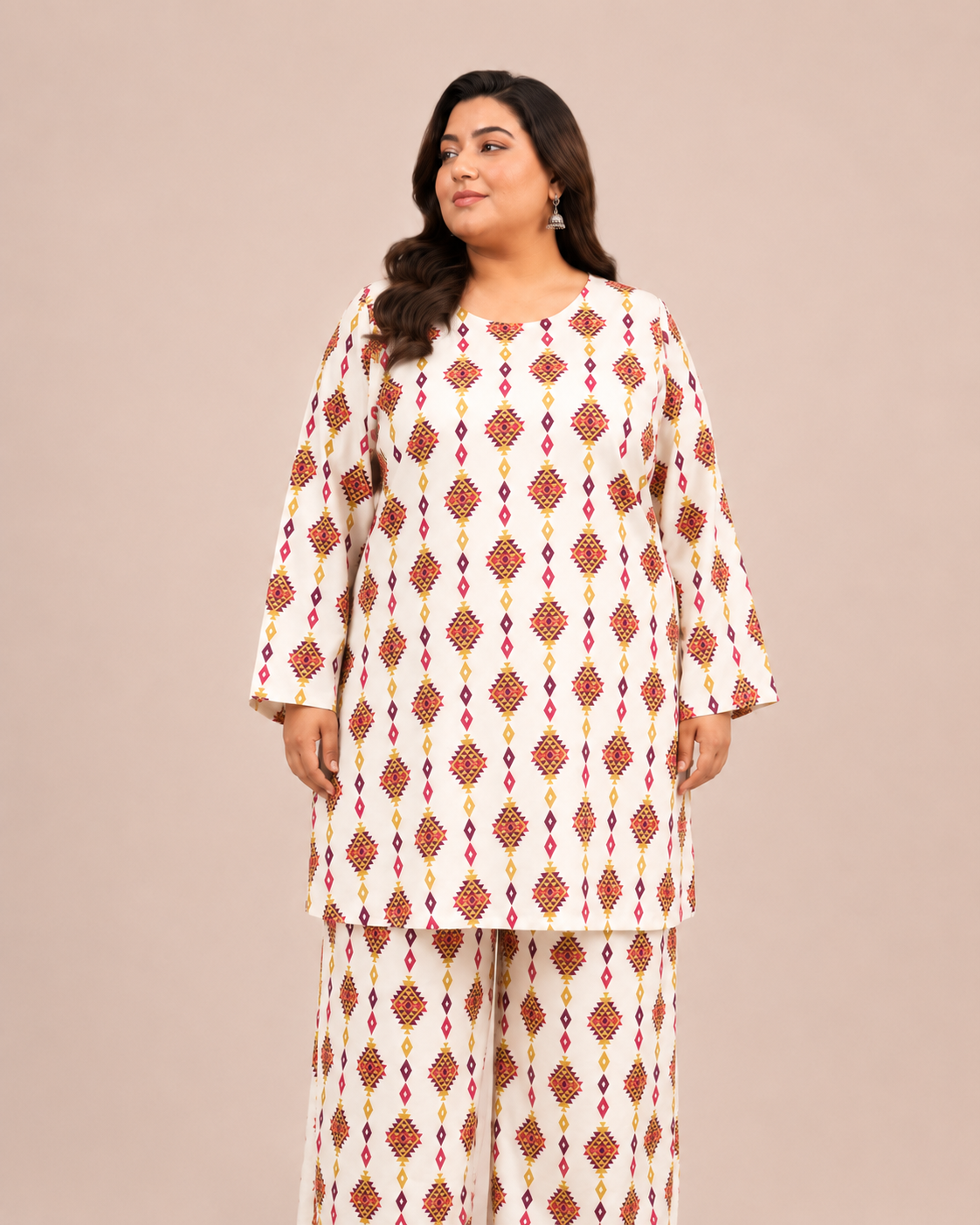 Front view of a plus-size model posing in a matching off-white and red geometric diamond printed cotton lawn kurta and wide trouser co-ord set.