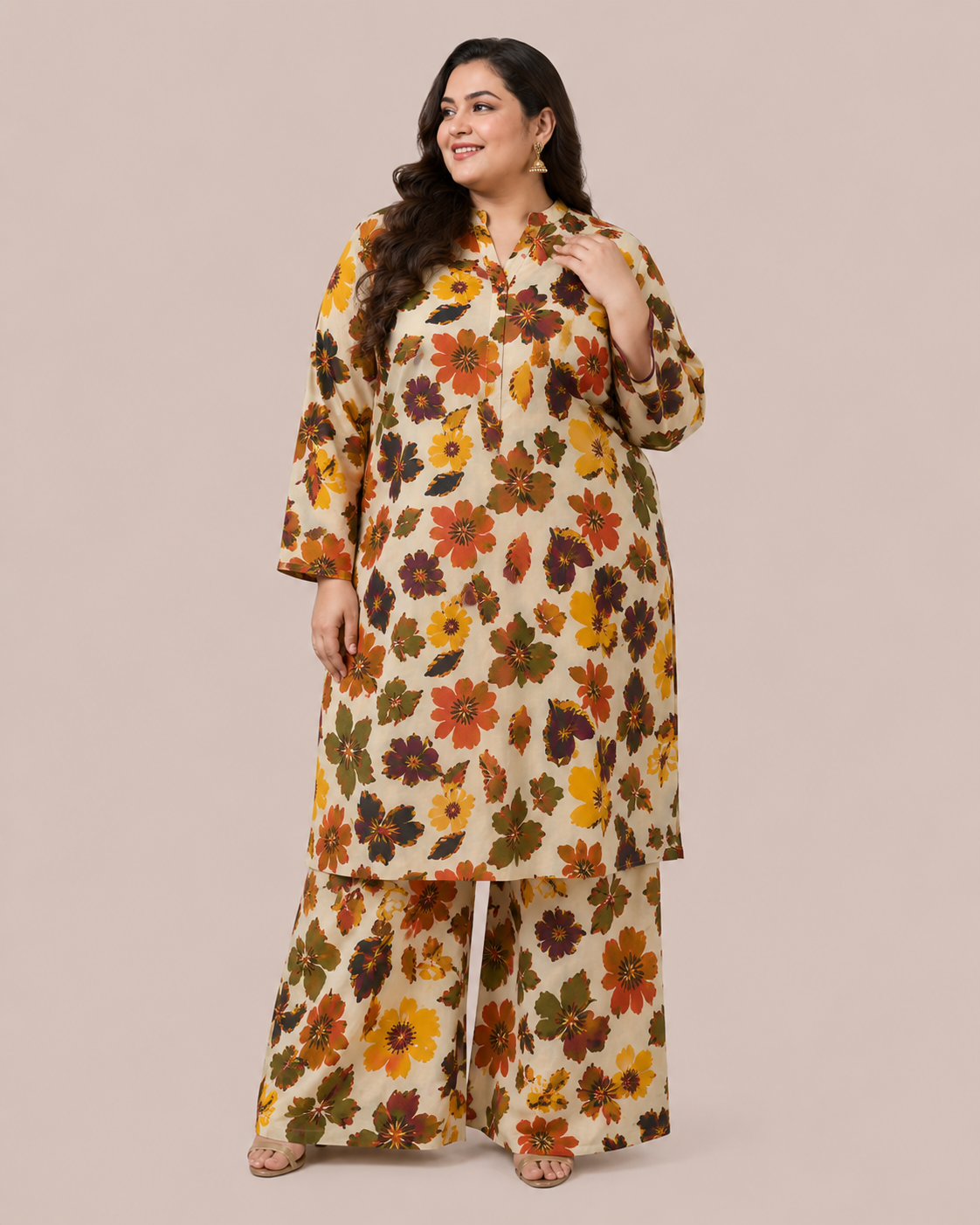 Three-quarter side angle view of a smiling plus-size model posing in a matching cream and multicolored orange-rust bold floral printed cotton lawn kurta set.